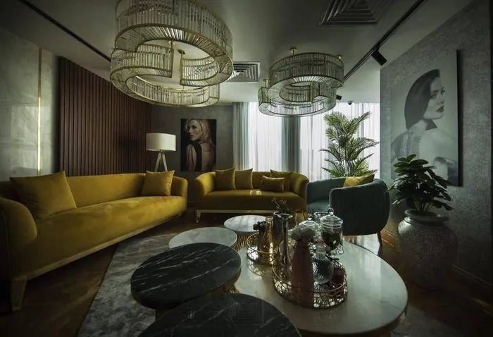 Patient lounge with gold velvet sofas