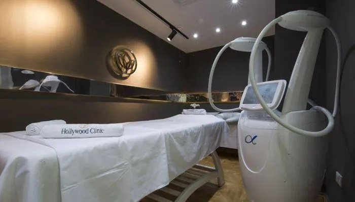 Alpha body-sculpting device in a treatment room
